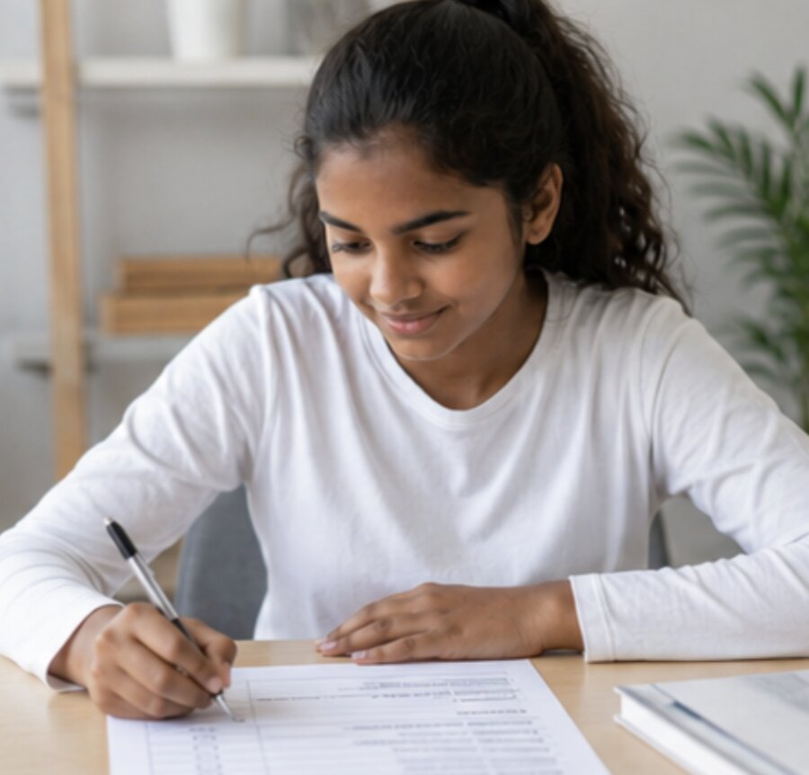 A student ticking off topics on her Ivy Maths curriculum checklist